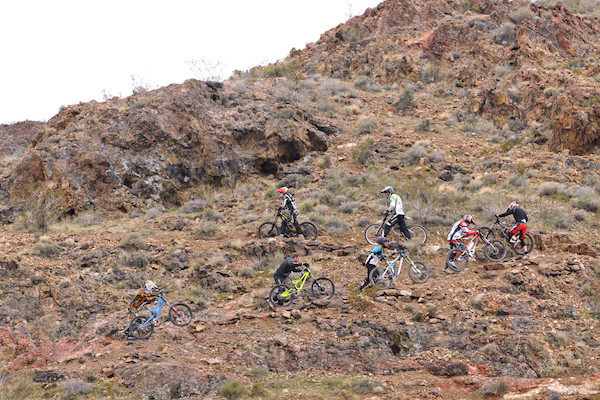 Riders hiking up for a practice run